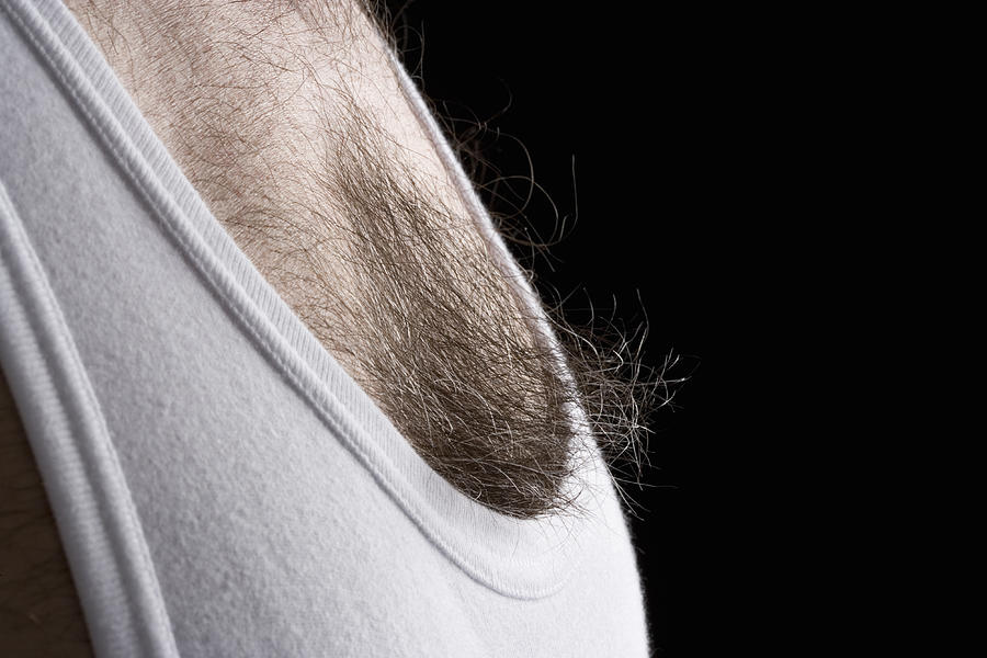 Man wearing white vest, close-up Photograph by Pjb