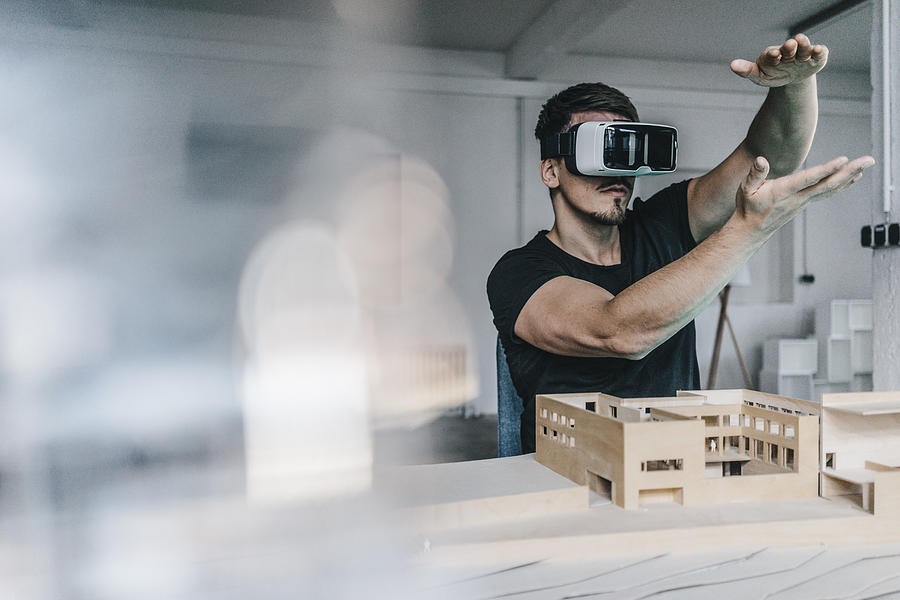 Man with architectural model and VR glasses Photograph by Westend61