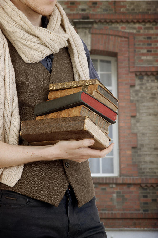 Young Man Carrying Old Books Photograph by Ethiriel Photography