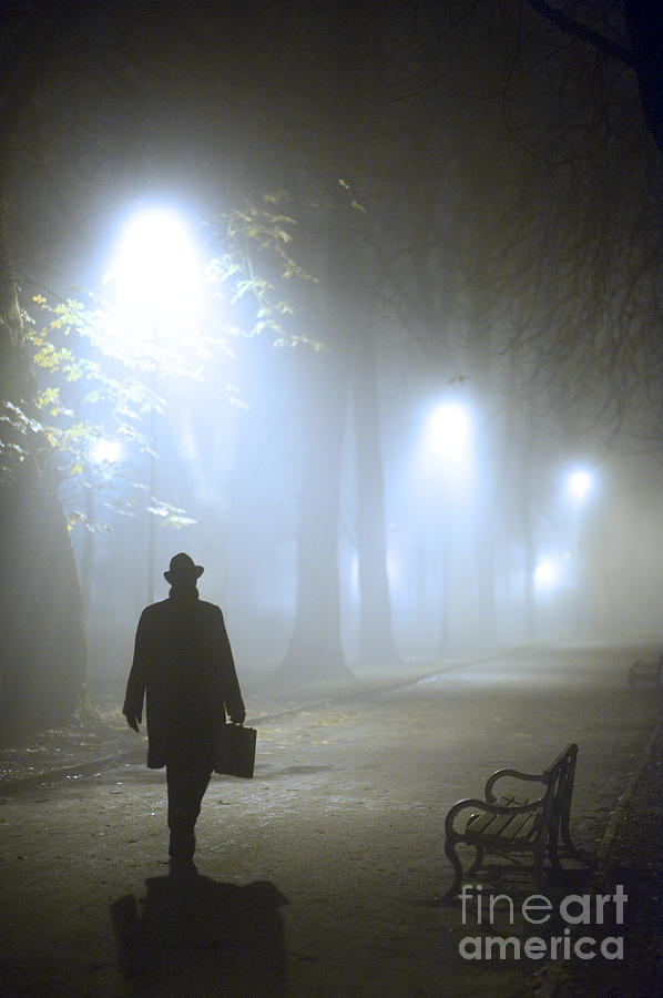 Man With Briefcase Walking On A Foggy Avenue At Night In Winter Photograph by Lee Avison