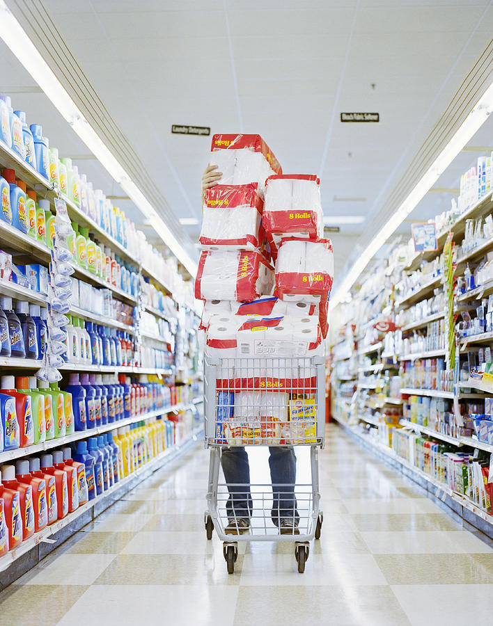 Man with cart stacked with grocery Photograph by Shannon Fagan