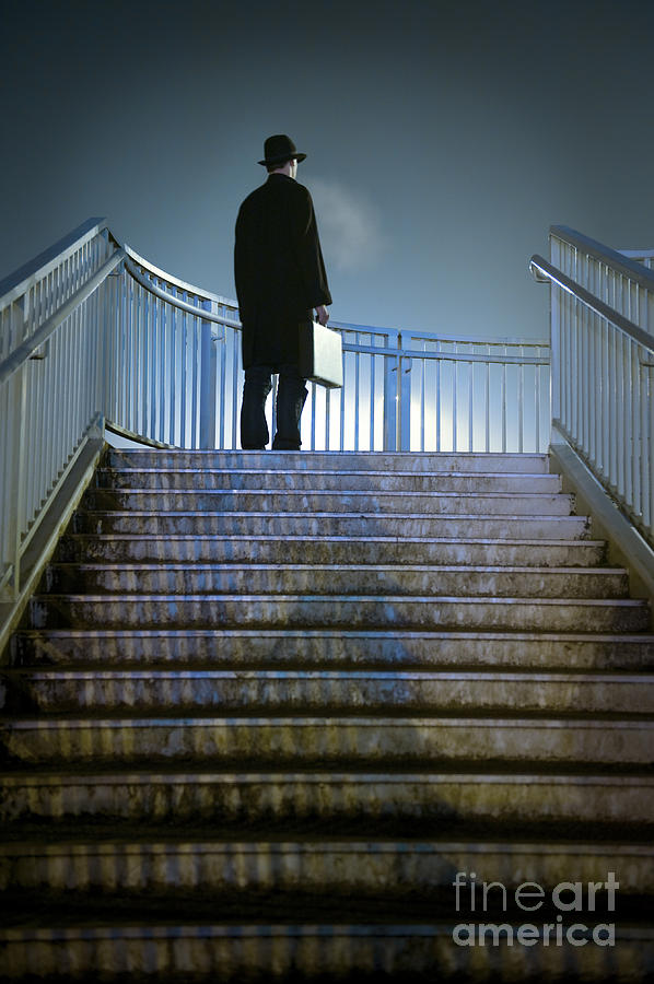 Man With Case At Night On Stairs Photograph by Lee Avison