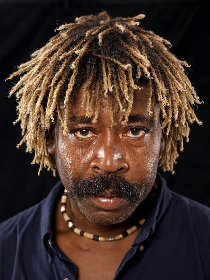 Man with dreadlocks, close-up, portrait Photograph by Bob Thomas