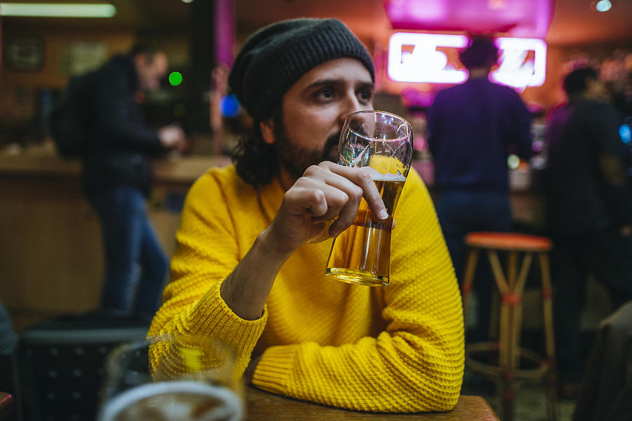 Man with glass of beer in a pub Photograph by Westend61