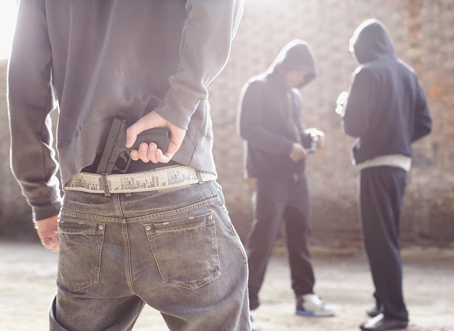 Man with gun robbing drug dealers Photograph by Paul Bradbury