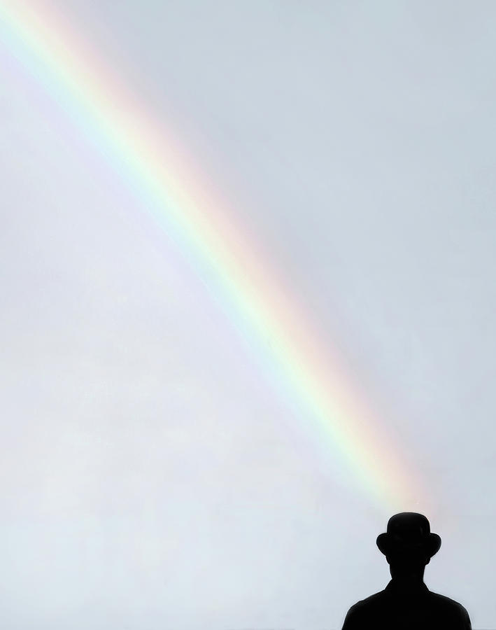 Man With Hat Looking Up At Rainbow Photograph by Grant Faint