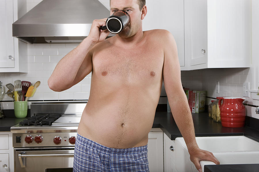 Man with pot belly drinking coffee Photograph by Sian Kennedy