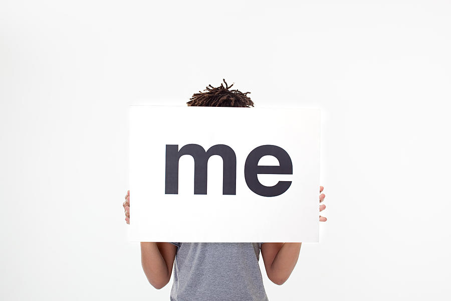 Man with sign that says me Photograph by Image Source