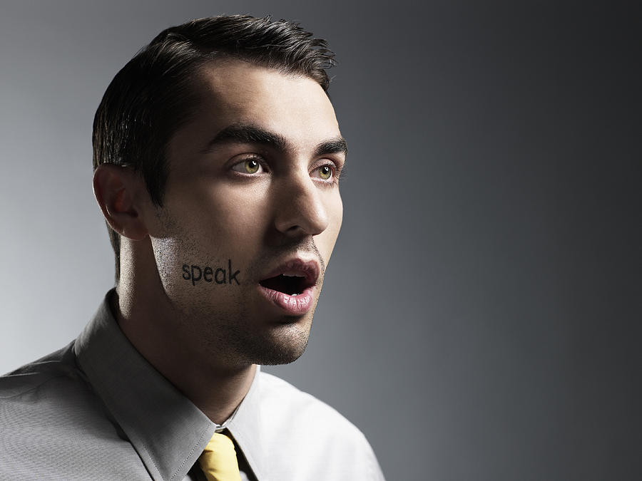 Man With speak Written On Face Photograph by Ryan McVay