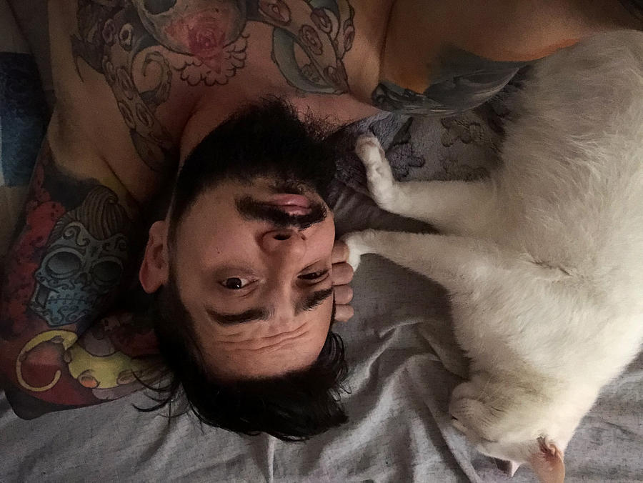 Man With White Cat In Bed Photograph by Vgajic