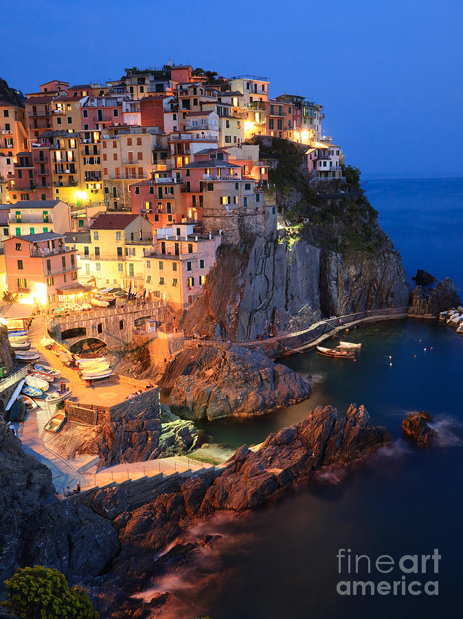 Manarola at night in the Cinque Terre Italy Photograph by Matteo Colombo