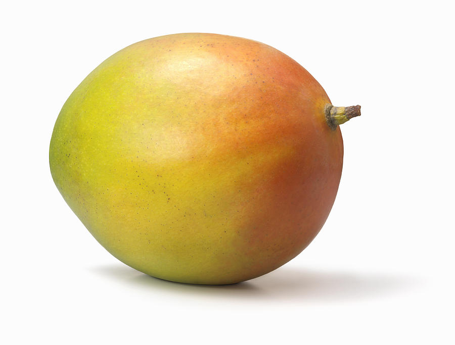 Mango on white background Photograph by Stuart Minzey
