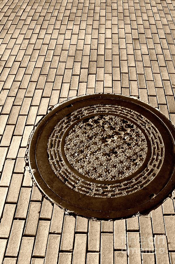 Manhole Cover and Bricks Photograph by John Harmon