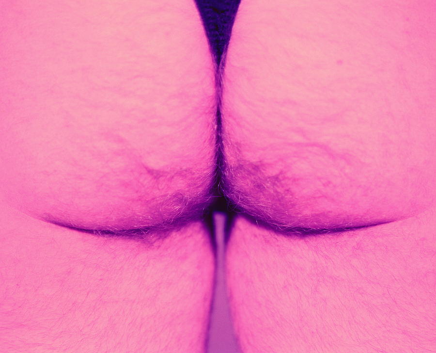 Mans hairy buttocks, close-up (cross-processed) Photograph by Gravity Images