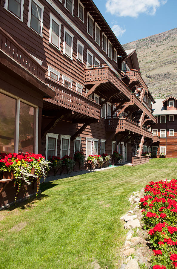 Many Glacier Hotel With Flowers Photograph by Bruce Gourley