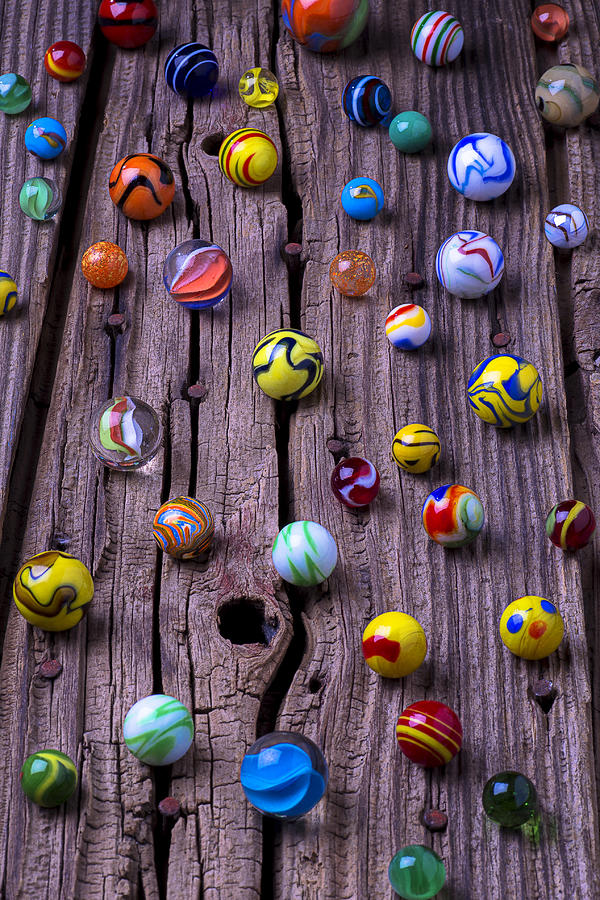 Toy Photograph - Marbles on wood by Garry Gay