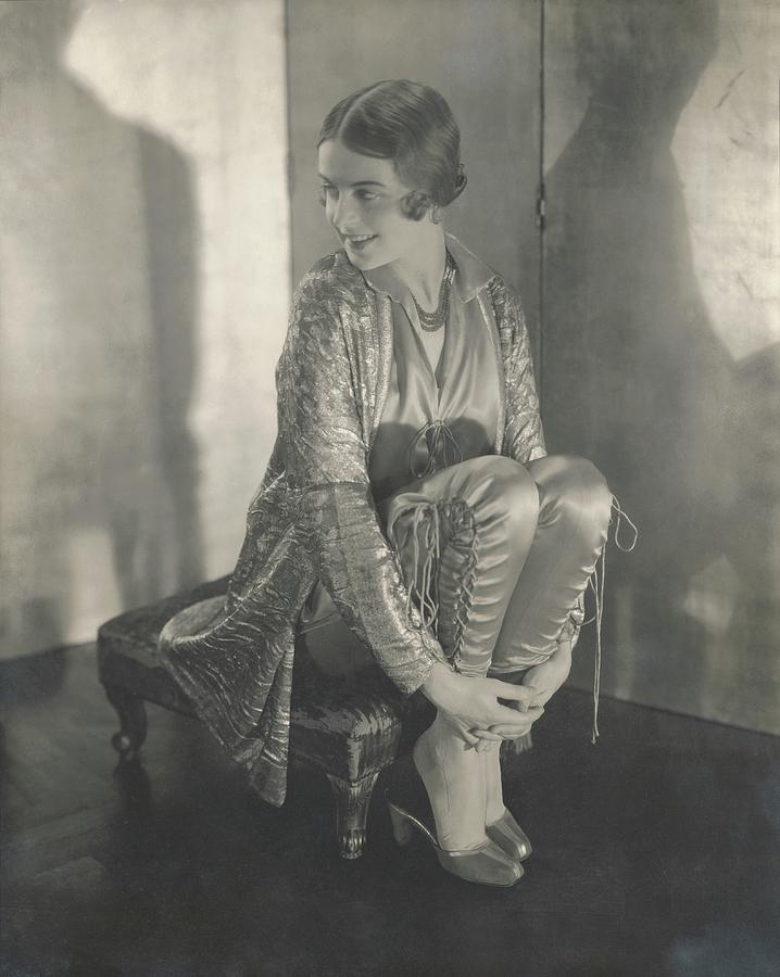Margaret Shea Sitting On A Footrest Wearing by Edward Steichen
