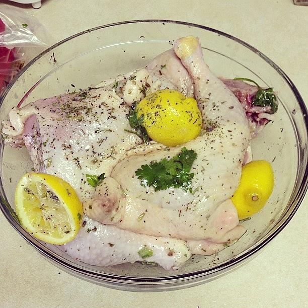 Marinating Chicken Quarters In Lemon Photograph by Chelsea Cherry