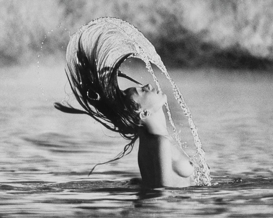 Marisa Berenson Flipping Her Hair In Water Photograph by Arnaud de Rosnay