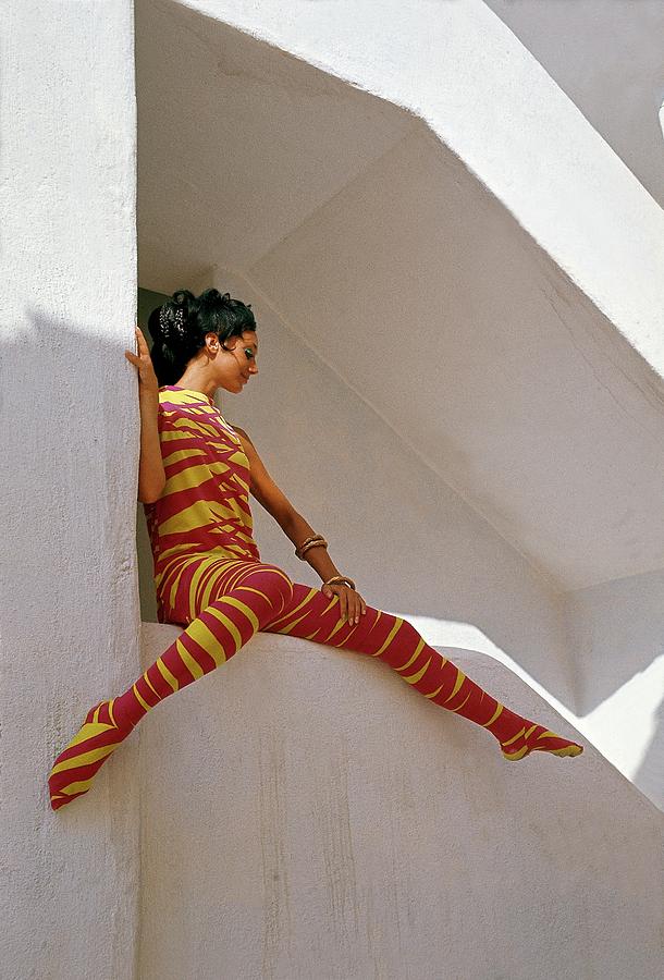 Marisa Berenson In An Orange And Yellow Striped Photograph by Henry Clarke