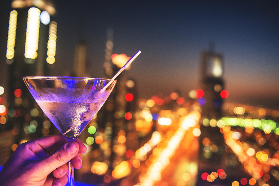 martini drink with city lights of Dubai downtown Photograph by Franckreporter