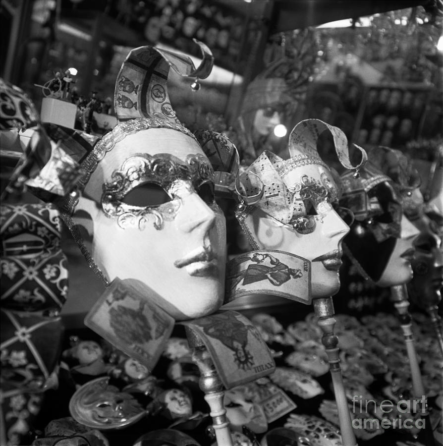 Masks in shop window Photograph by Riccardo Mottola