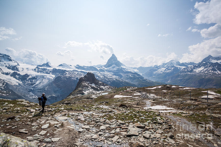 Matterhorn in summer with hiker Zermatt Switzerland Photograph by Matteo Colombo