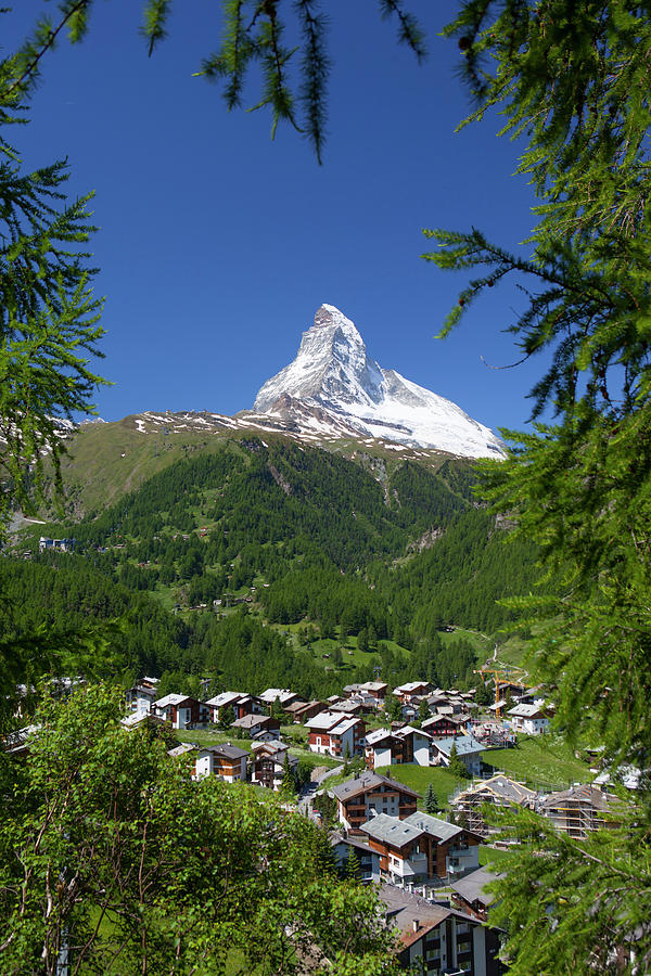 Matterhorn Mountain Rising Above Town Photograph by Menno Boermans Matterhorn Mountain Rising Above Town Photograph by Menno Boermans