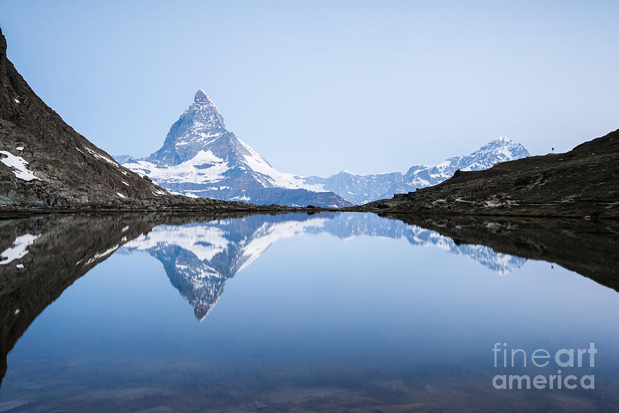 Matterhorn reflected in Riffelsee lake at sunrise Photograph by Matteo Colombo