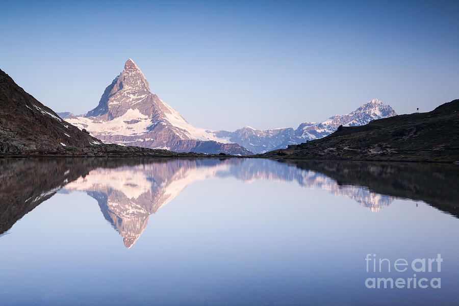 Matterhorn reflected in Riffelsee lake at sunrise Zermatt Switzerland Photograph by Matteo Colombo