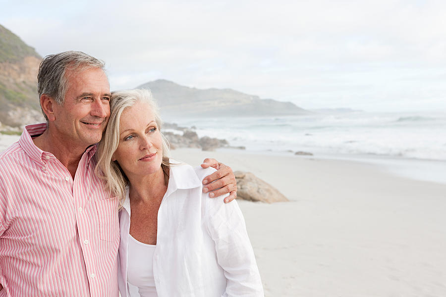 Mature couple at the beach Photograph by Image Source
