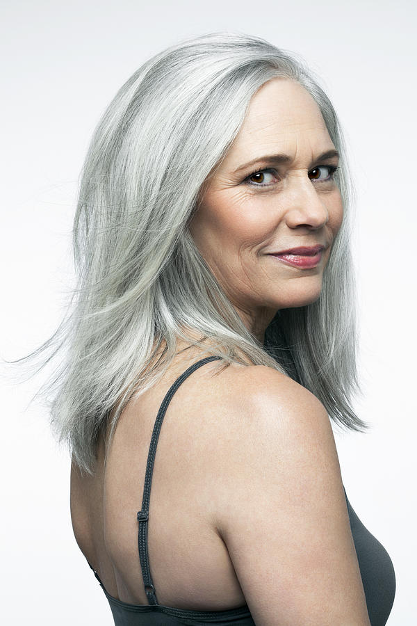 Mature woman with grey hair in a 3/4 position. Photograph by Andreas Kuehn