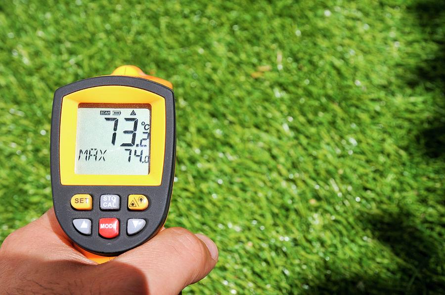 measuring-temperature-of-artificial-lawn-photograph-by-photostock