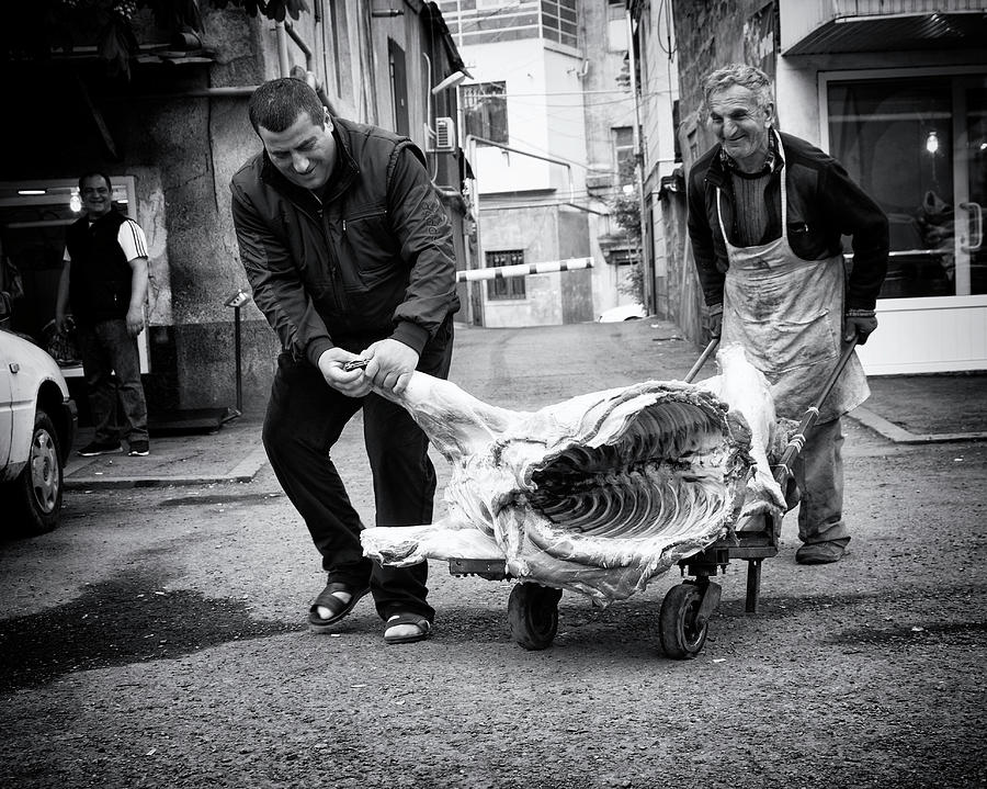 Black And White Photograph - Meat Is Coming by Marcel Rebro