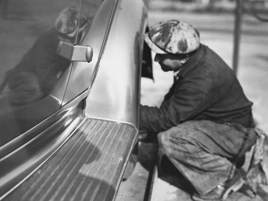 Mechanic Working On Car Photograph by Underwood Archives