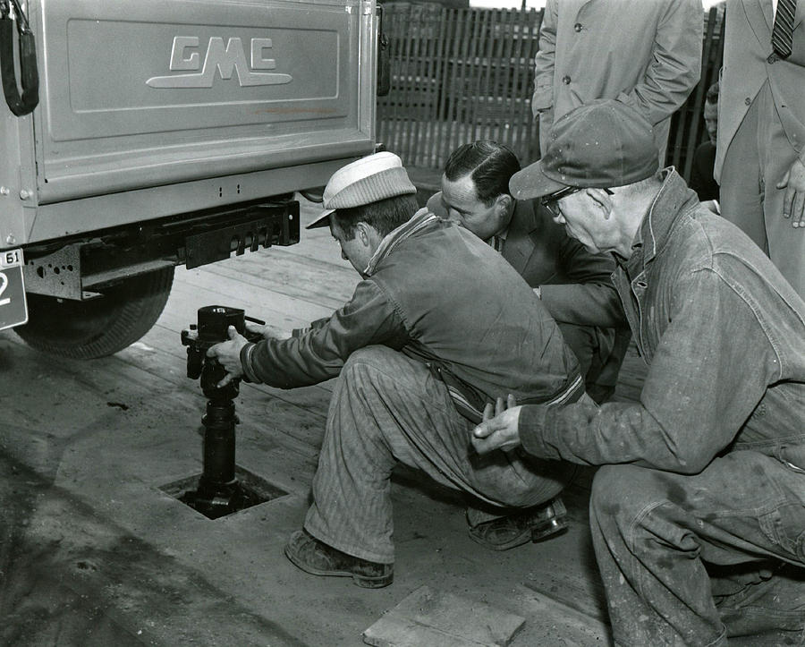 Vintage Photograph - Mechanics Working On Vintage Truck by Retro Images Archive