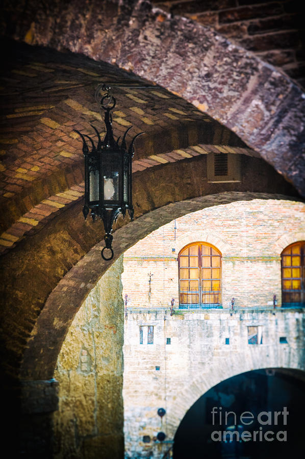 Medieval arches with lamp Photograph by Silvia Ganora