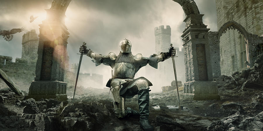 Medieval Knight Kneeling With Sword In Front of Building Ruin Photograph by Peepo