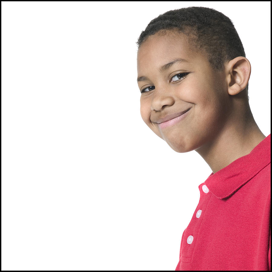 Medium Close Up Shot Of A Male Child In A Red Shirt As He Flashes A Big Grin Photograph by Photodisc
