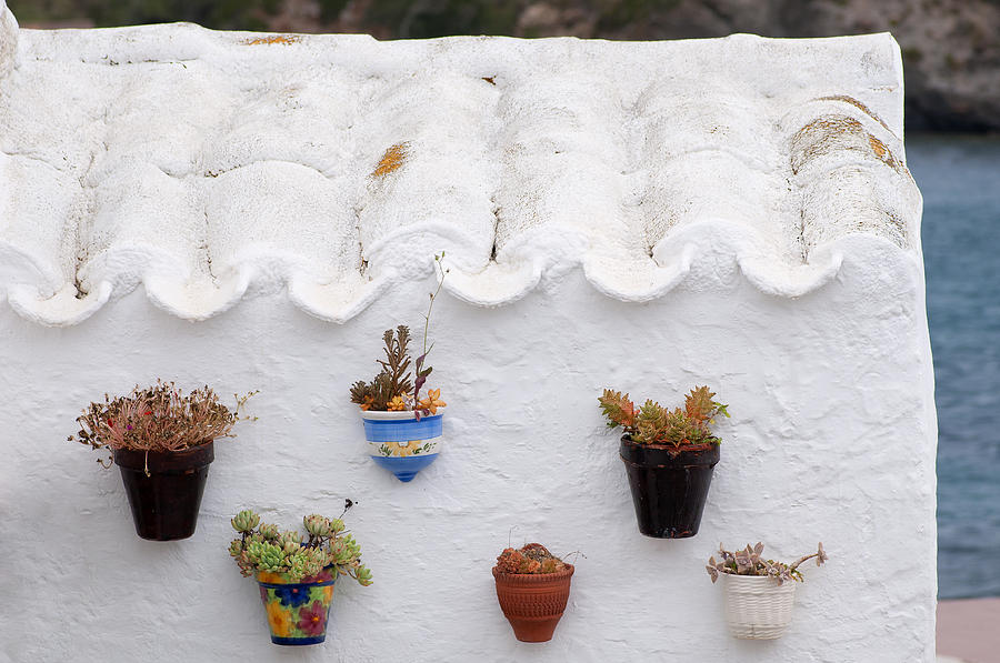 White - An antique house of the village of Es Grau Menorca with traditional handpainted pottery Photograph by Pedro Cardona Llambias