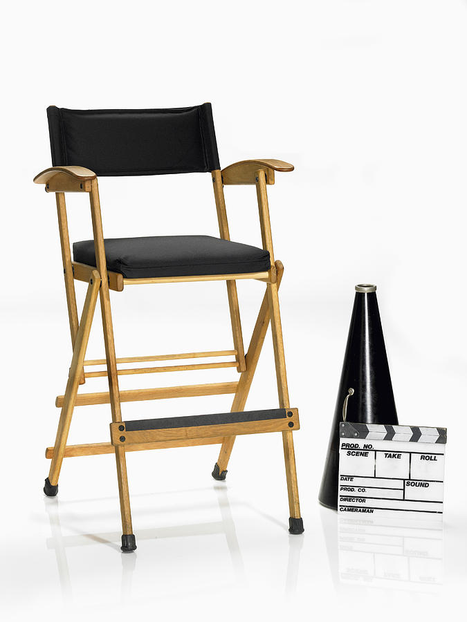 Megaphone and movie slate by directors chair Photograph by Lew Robertson, Brand X Pictures
