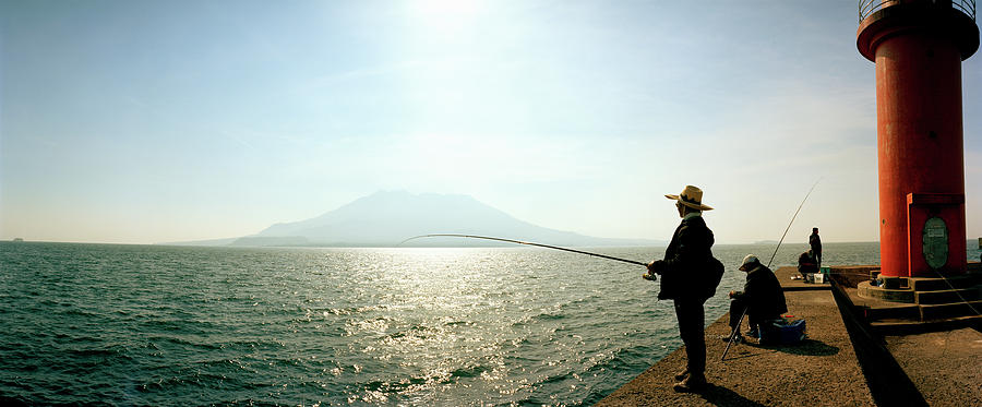 Architecture Photograph - Men Fishing In Sakurajima Island by Panoramic Images