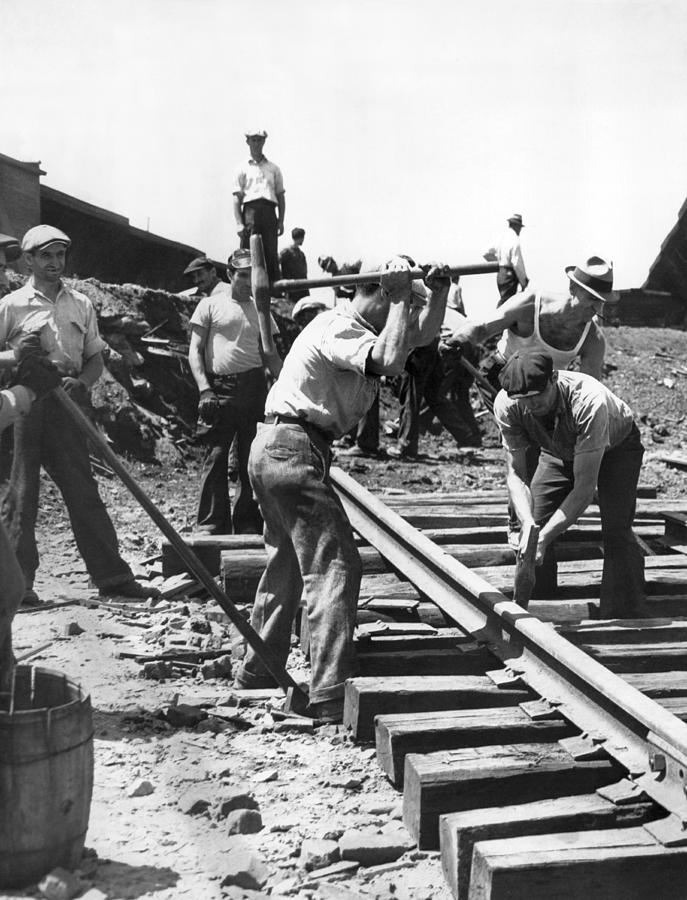 Architecture Photograph - Men Laying Railroad Track by Underwood Archives