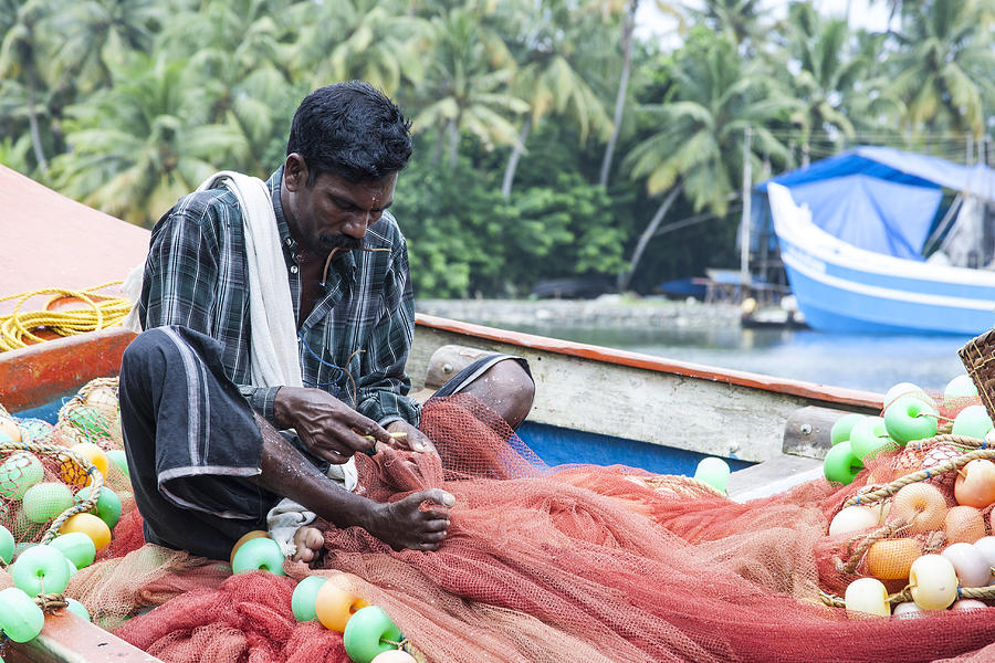 Mending Fishing Nets Photograph by Sonny Marcyan