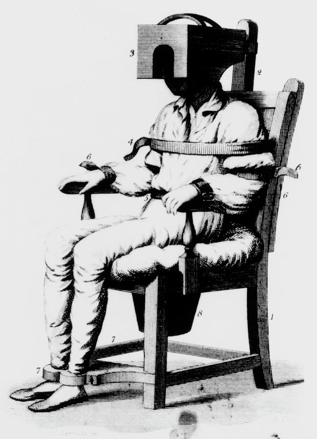 Black And White Photograph - Mental Patient Strapped Into A Restraining Chair by National Library Of Medicine/science Photo Library
