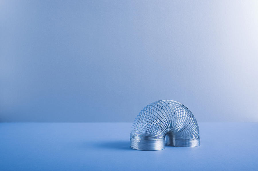 Metal coil toy Photograph by Martin Barraud