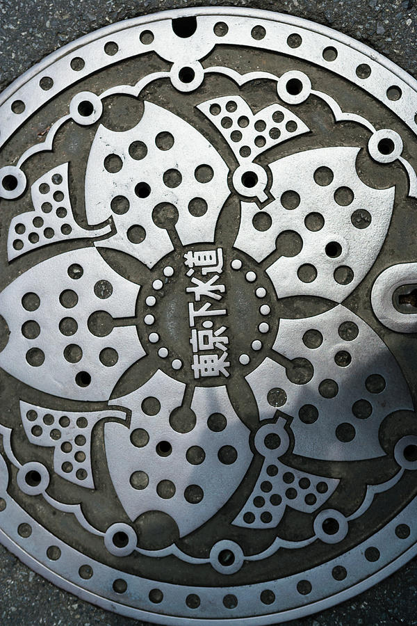 Metal Manhole Cover With Japanese Text Photograph by Ron Koeberer