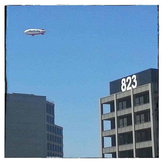Austin Photograph - Metlife Blimp Flying Over Downtown by Sean Wray