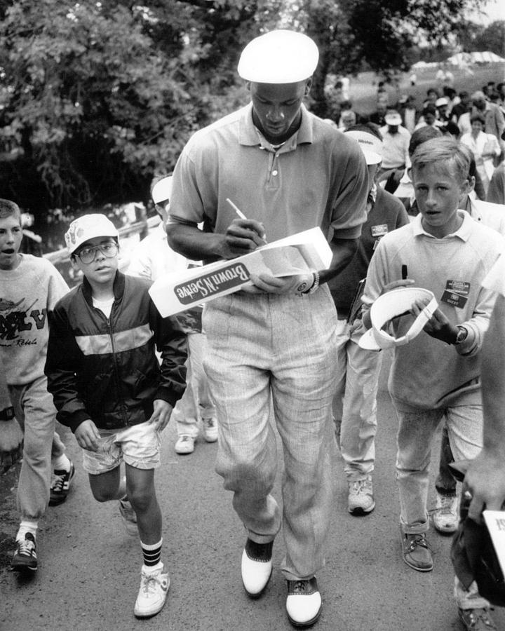 Michael Jordan Signing Autographs Photograph by Retro Images Archive