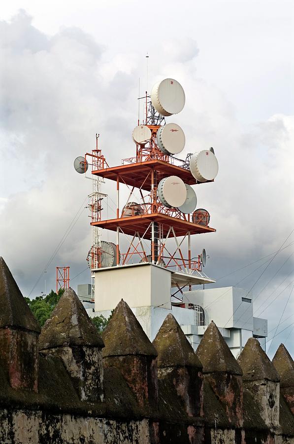 Microwave Antennas Behind An Ancient Wall Photograph by Daniel Sambraus/science Photo Library